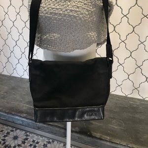 Tumi travel messenger bag.